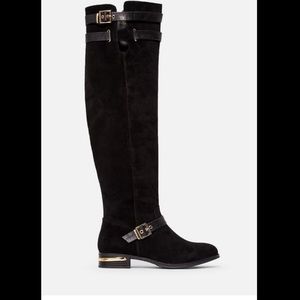 Black riding boot with gold buckle details